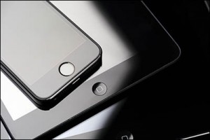 Tambov, Russian Federation - February 26, 2015 Close up of stack of Apple devices - iPhone 5s, iPad mini and iPad 2. Studio shot.